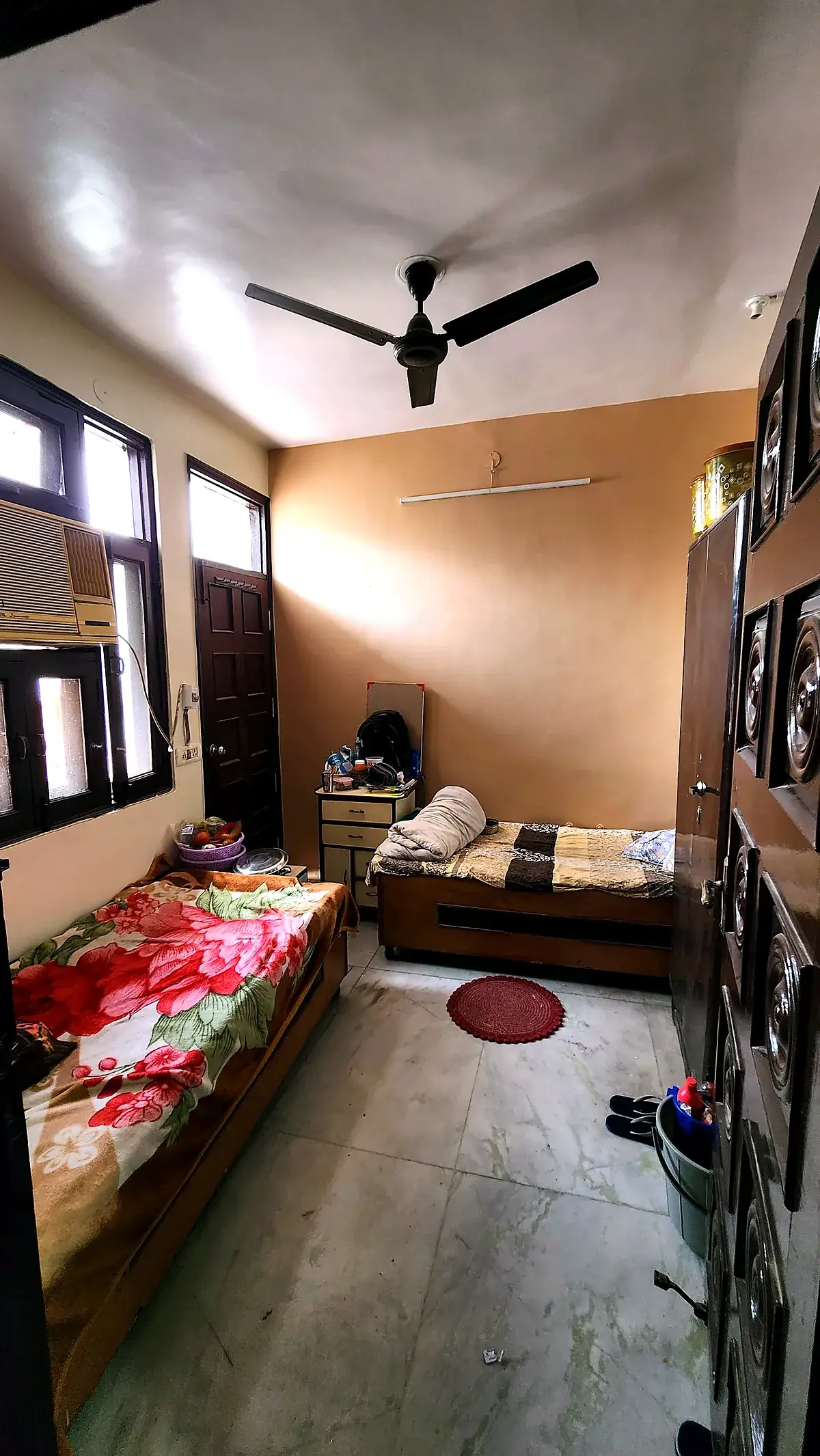 Room with wooden wardrobe at PG for Girls in Rohini